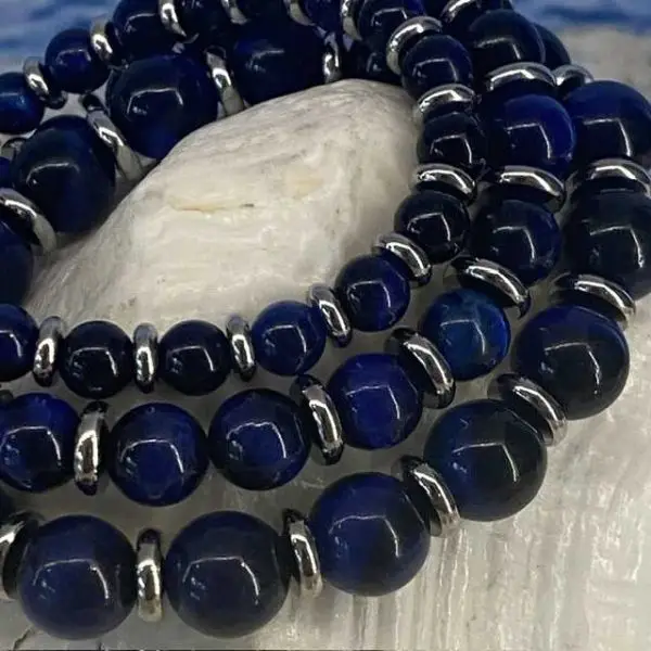 Armband JaXX Tijgeroog blauw met edelstalen spacers