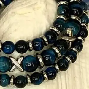 Armbanden JaXX/Cross tijgeroog turquoise 6 en 8 mm met Edelstaal